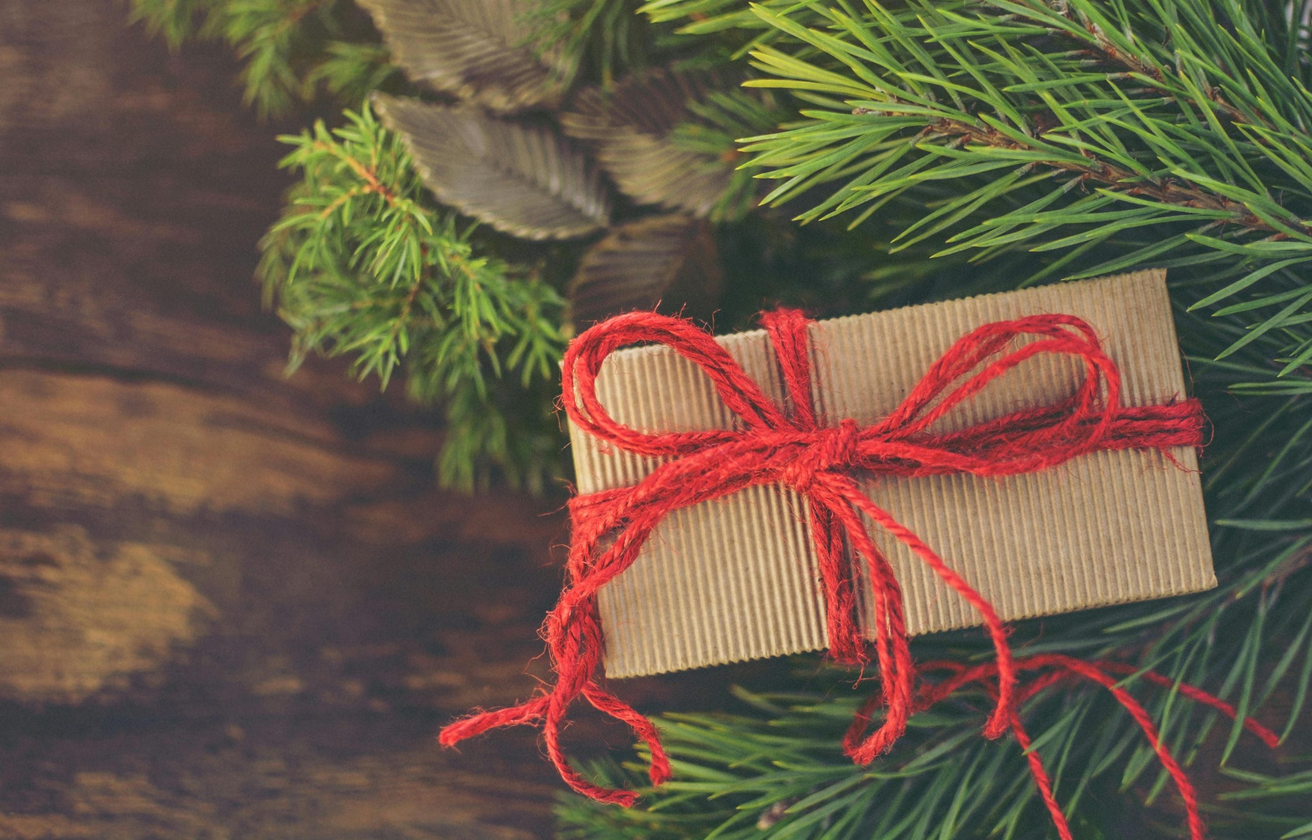 Minimalist gift wrapping and a budget planner on a table