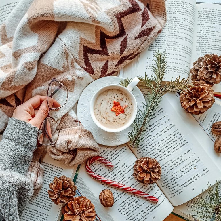 7 best Christmas gifts for book lovers 2025 including Kindles, Kindle Kids, Audible, Kindle Unlimited, reading accessories, and cozy blankets.