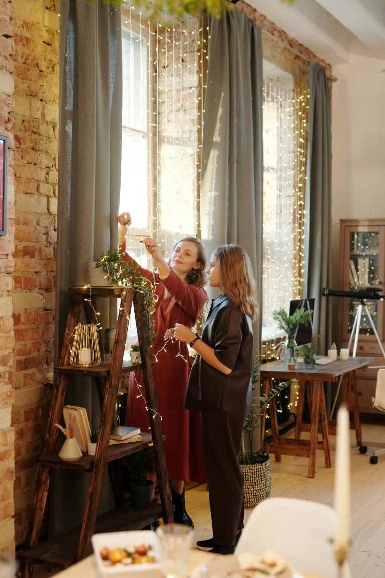 teen girl and mom decorating for Christmas
