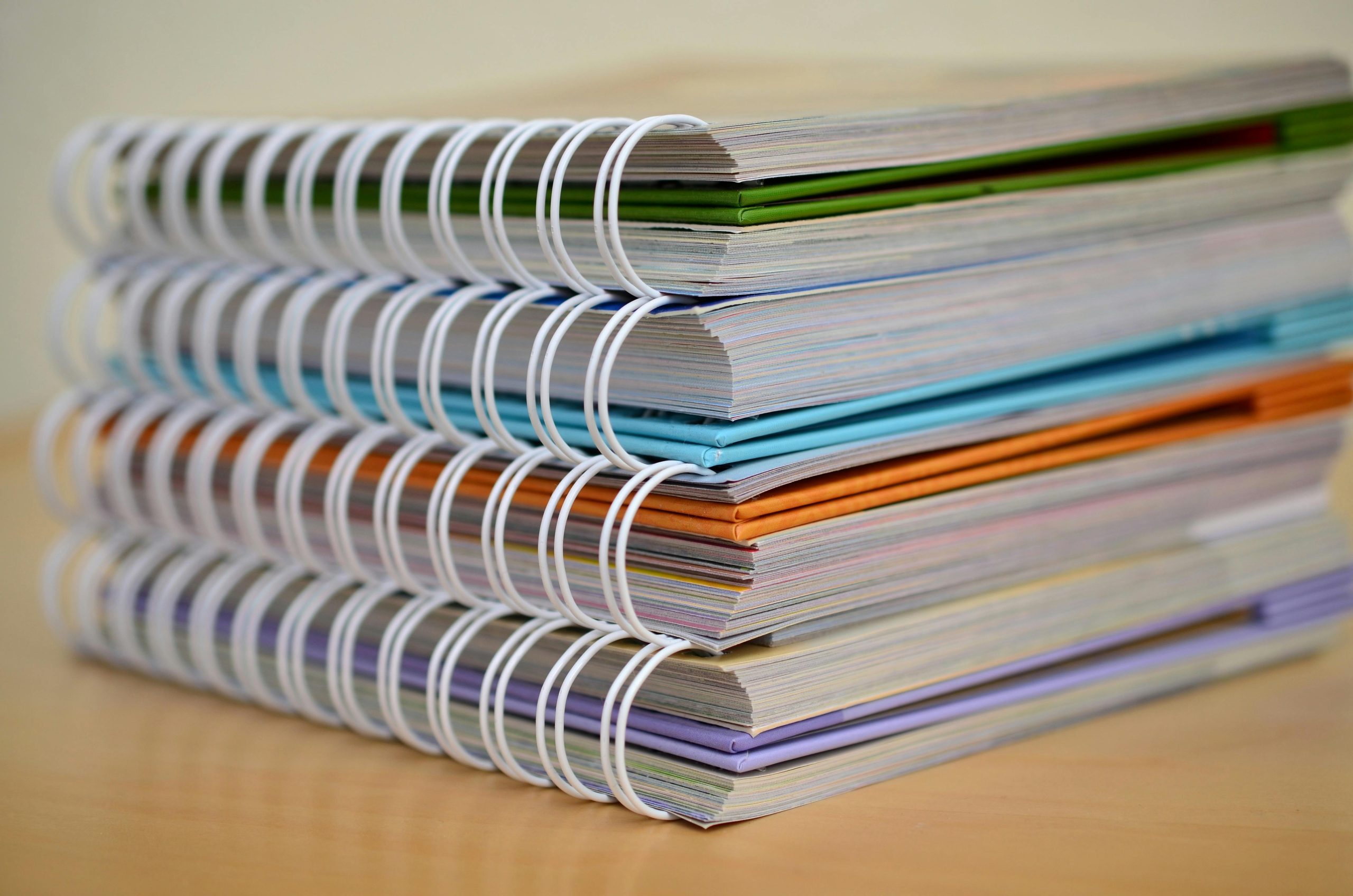 Binder and notebooks used to organize important documents at home for emergency preparedness