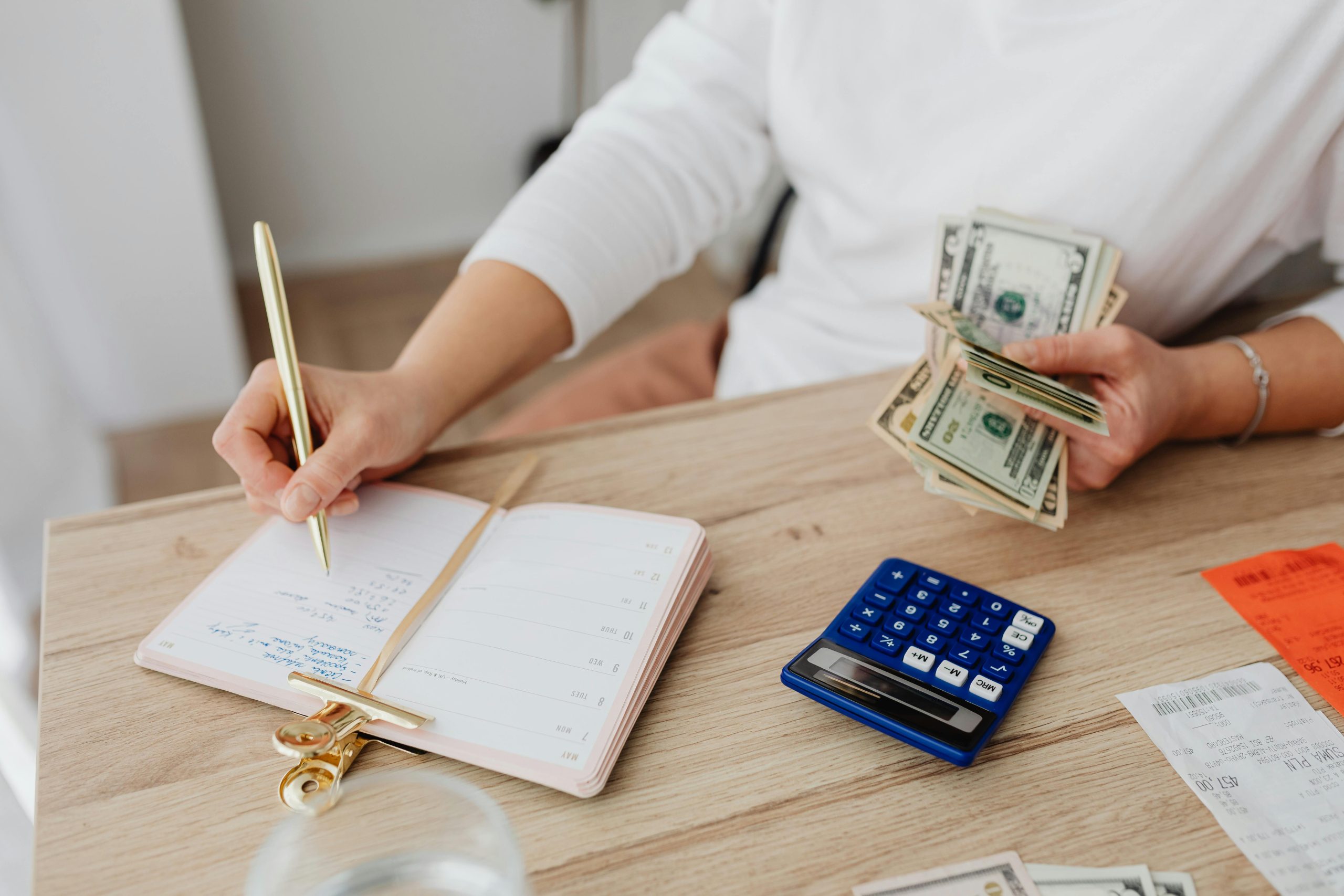 Woman reviewing finances and budgeting as part of a weekly money reset routine